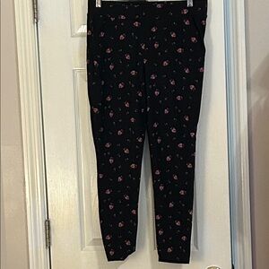 Torrid Black leggings with Red Floral Design and one with polka dots